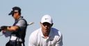 McIlroy toils to opening 80