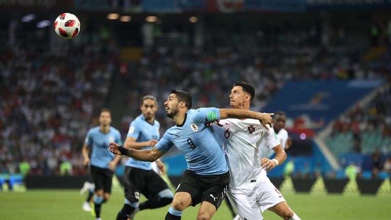 Suarez battles for possession against Jose Fonte