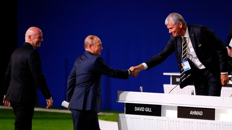 President of Russia, Vladimir Putin, shakes hands with FIFA Vice President Gill