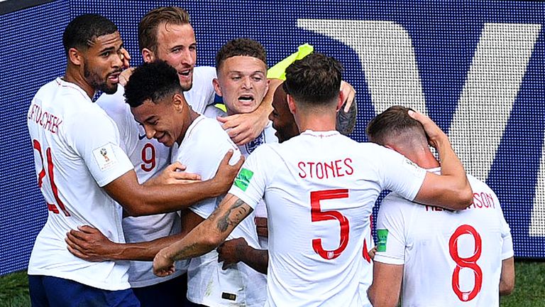 England players congratulate goalscorer Kane