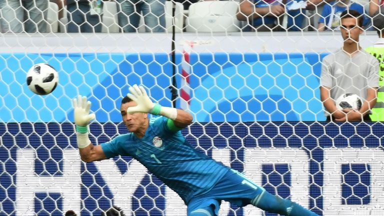   Essam El-Hadary, the oldest player to to have participated in the World Cup, saves a penalty from Fahad Al-Muwallad 