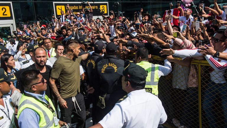 Paolo Guerrero (C) was greeted by supporters as he arrives at the Jorge Chavez airport in Lima on May 15, 2018 a day after the Court of Arbitration for Sport (CAS) increased his ban