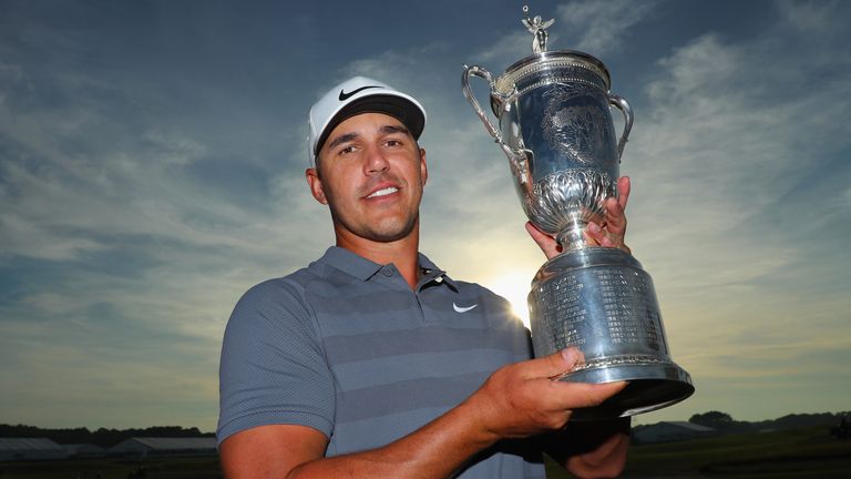 Brooks Koepka proudly displays the US Open trophy