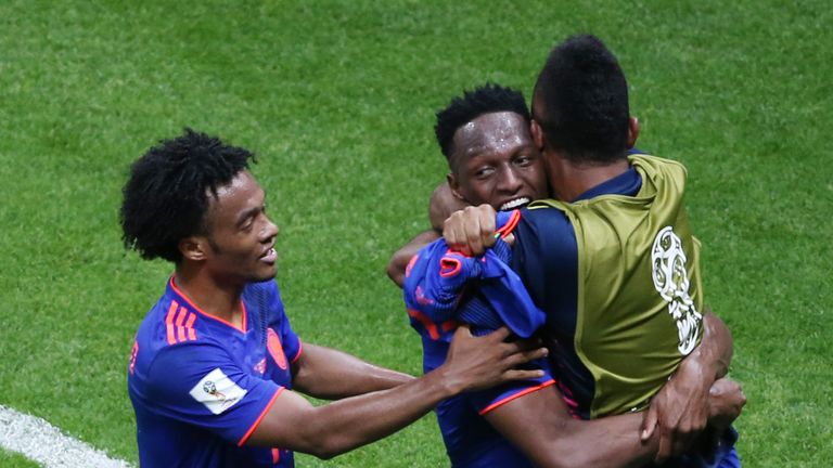 Yerry Mina celebrates scoring Colombia's opener against Poland at the World Cup