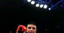 Munguia dominates Smith to retain title