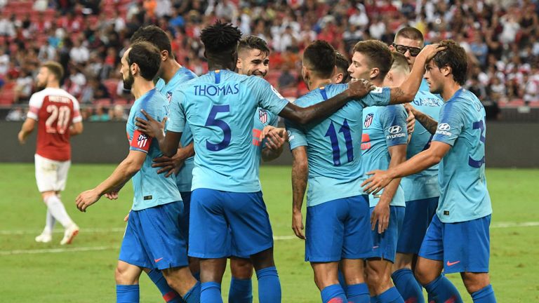 Atletico Madrid players celebrate Luciano Vietto's opener in Singapore