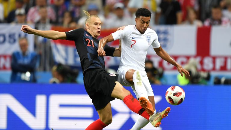 Jesse Lingard vies with possession with Domagoj Vida