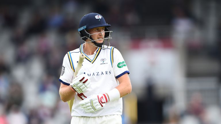 Joe Root trudges off after being trapped lbw by Clark at Old Trafford