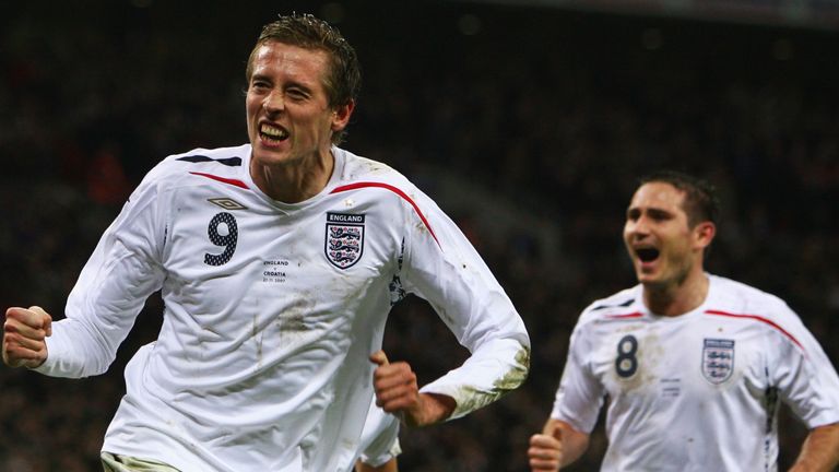   Peter Crouch celebrates after having pulled the English level 