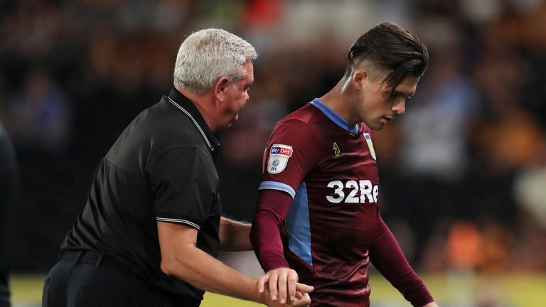 Jack Grealish shakes hands with manager Steve Bruce as he is substituted at Hull