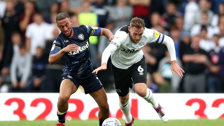 Roofe and Derby County's Richard Keogh battle for the ball at Pride Park