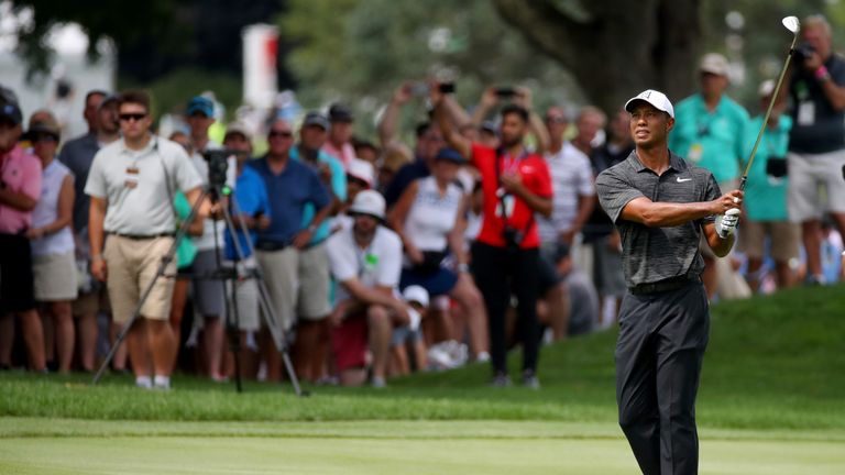 Tiger Woods is five behind at the halfway stage