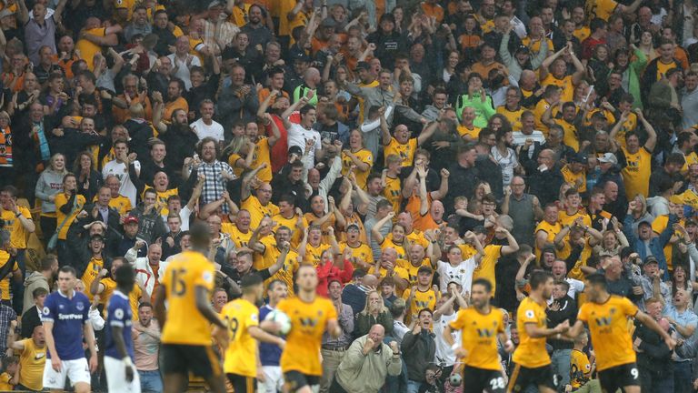 Wolves fans celebrate during their 2-2 home draw against Everton