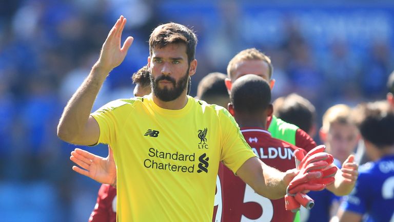 Alisson salutes the Liverpool fans after his error at Leicester