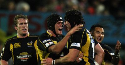 Celebration: George Skivington (right) is mobbed after his try