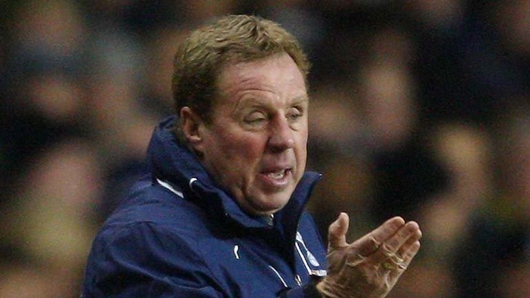 Harry Redknapp watches his side in the Carling Cup semi final first leg.