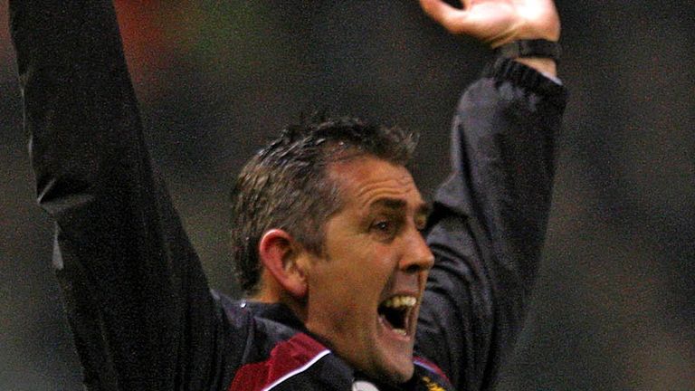 Owen Coyle celebrates as Burnley pull themselves back into the cup tie.