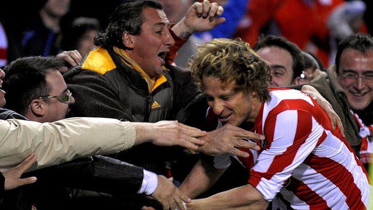 45th minute: Diego Forlan celebrates his goal with the Vicente Calderon faithful.