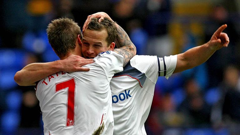 The goalscorers celebrate as Davies adds the second.