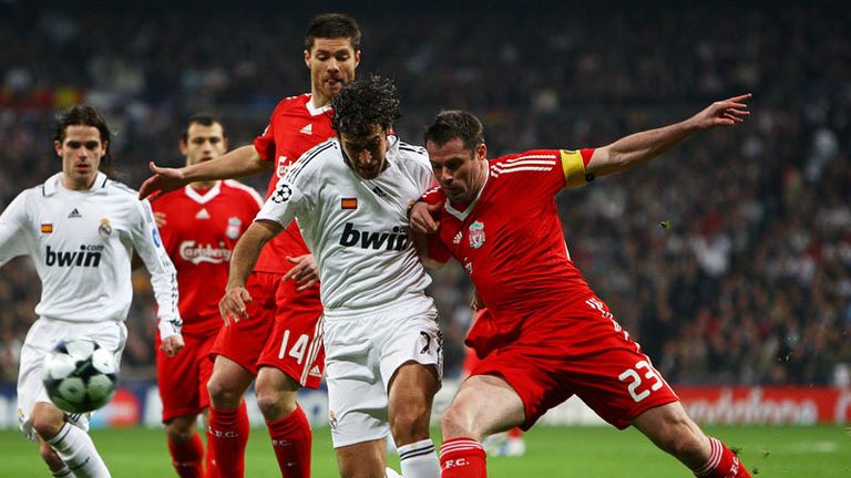 Jamie Carragher keeps Raul quiet.