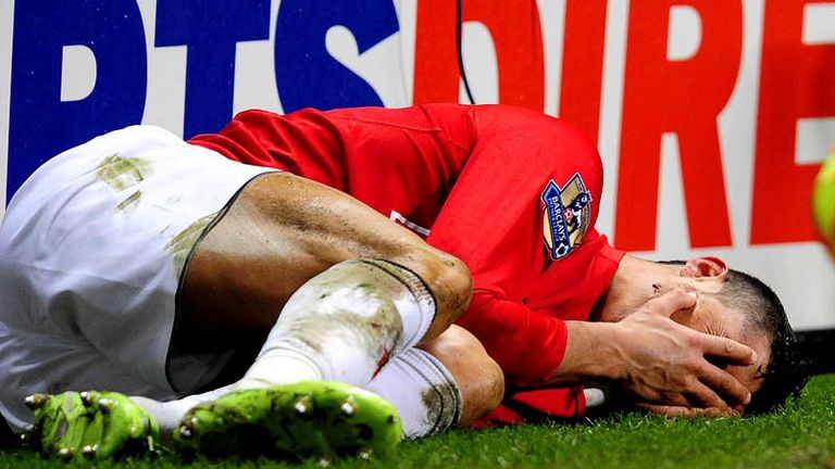45th minute: Cristiano Ronaldo lies on the turf after being caught in the face by Steven Taylor.