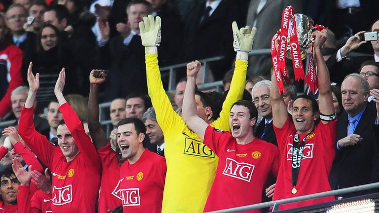 Skipper Rio Ferdinand lifts the Carling Cup for Manchester United after defeating Tottenham.