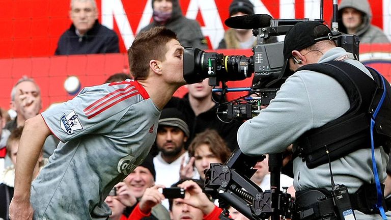 Kisses all-round, one for the camera from Gerrard after netting.