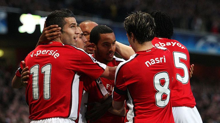 10th minute: Arsenal celebrate Theo Walcott's opener.