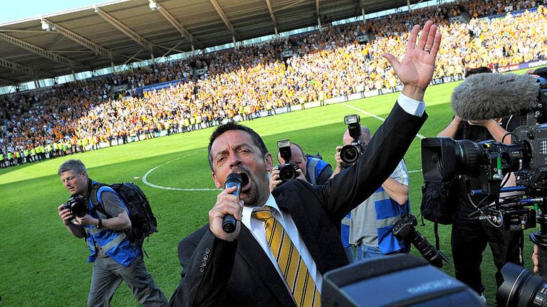 Hull City manager Phil Brown leads the celebrations at the KC Stadium.