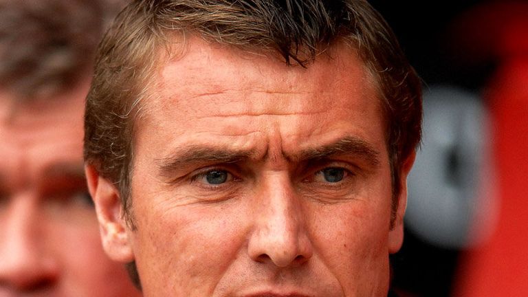 Lee Clark watches his Huddersfield take on MK Dons.