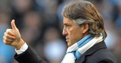 Case for the defence: Mancini is likely to bolster at the back