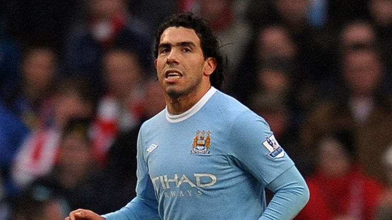 Carlos Tevez celebrates after banging the ball down the middle from a 12th minute penalty