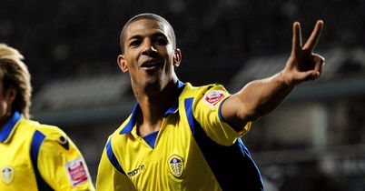 Jermaine Beckford nets a double as Leeds United earn a FA Cup replay after drawing 2-2 with Tottenham at White Hart Lane.