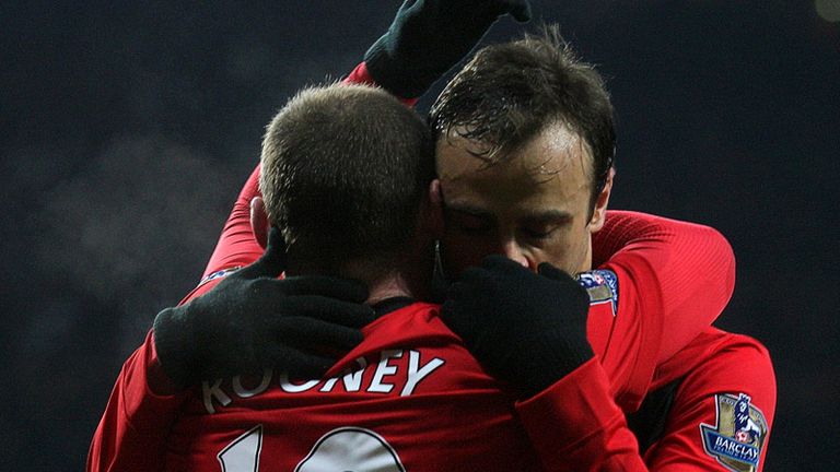 The under-fire Bulgarian striker celebrates his goal with the provider Wayne Rooney