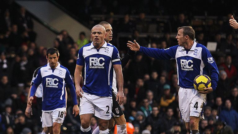 Stephen Carr pushes Gera on the edge of the area in the 90th minute