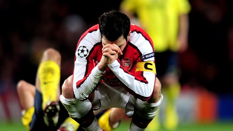 Cesc Fabregas reacts to a booking that will see him miss the second leg at the Nou Camp