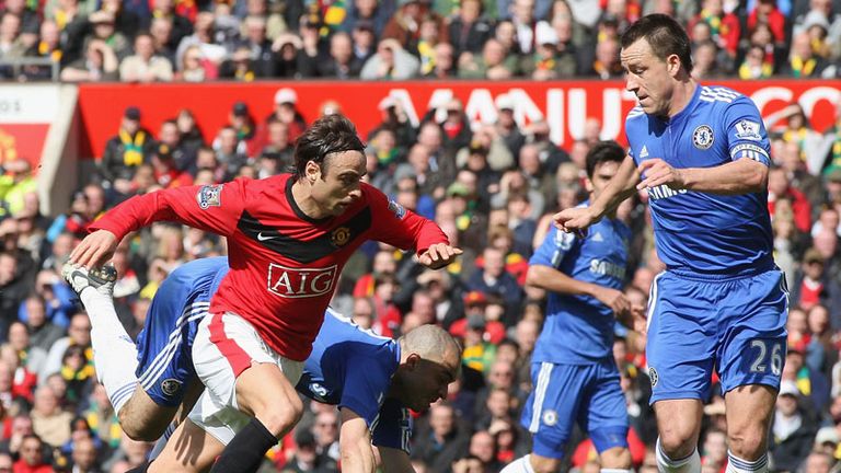 Dimitar Berbatov attempts to take on John Terry