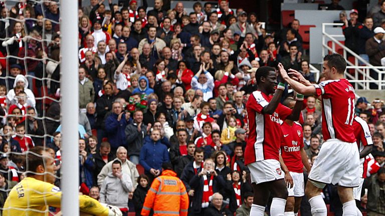 Van Persie and Eboue celebrate after Baird's own goal makes it 3-0