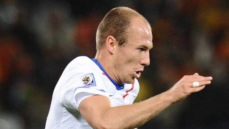Robben runs with the ball on his return to fitness after a hamstring injury.