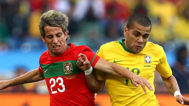Competition: Portugals Fabio Coentrao, left, and Dani Alves comepte for the ball.