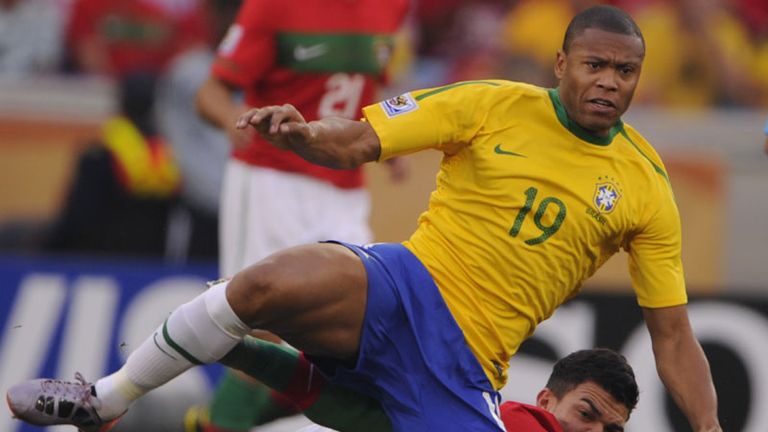Good battle: Julio Baptista, left, fights for the ball with Portugals Pepe.
