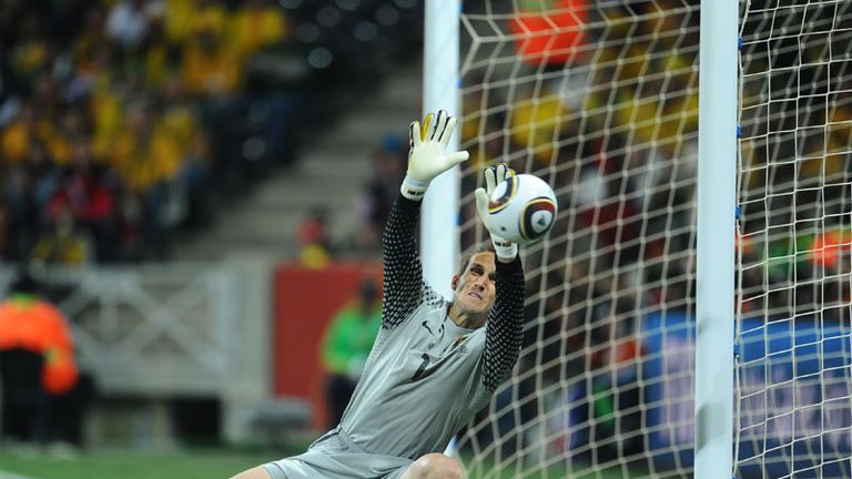 Mark Schwarzer is in no mood to concede and he beats away another Serbia chance