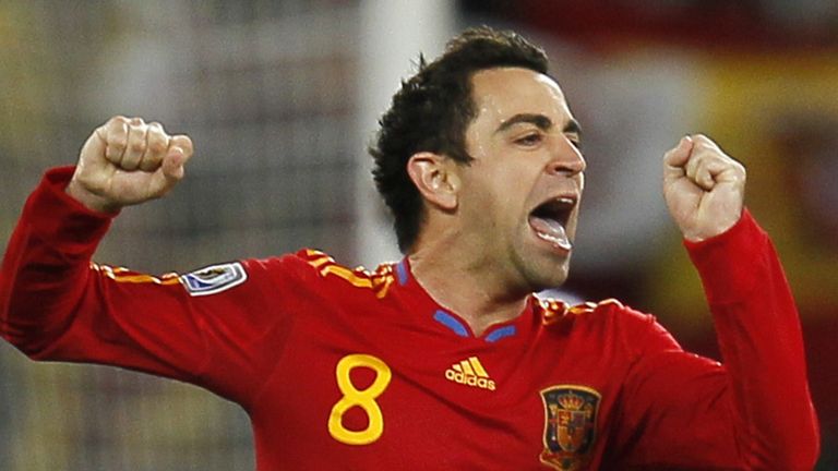 Xavi celebrates for Spain