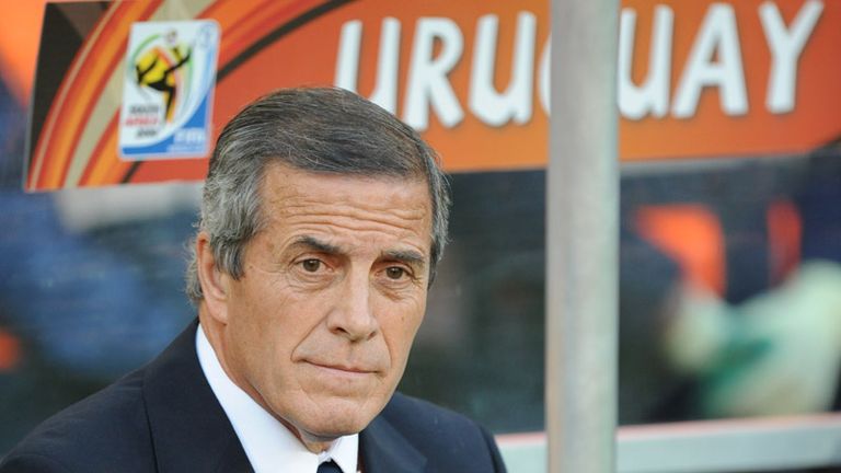 Oscar Tabarez takes his place on the bench.