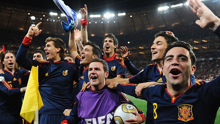 The Spain team celebrate as Iniesta seals victory in extra-time