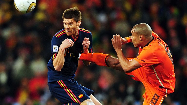 De Jong is booked for this high foot on Xabi Alonso