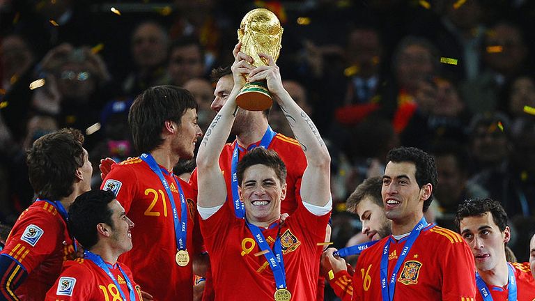 Torres gets his hands on the biggest prize in world football