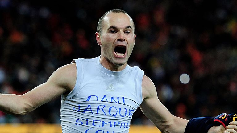 Iniesta celebrates scoring the winning goal in the World Cup final