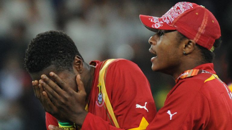 Asamoah Gyan hides his tears.