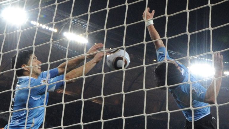 Luis Suarez handballs.